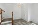 Welcoming foyer with wood floors and contemporary lighting fixture at 6707 Brachnell View Dr, Charlotte, NC 28269