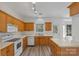 Well-lit kitchen with a bright window, and an island perfect for cooking at 6707 Brachnell View Dr, Charlotte, NC 28269