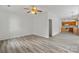 Living room with hardwood floors and a view into the adjacent kitchen at 6707 Brachnell View Dr, Charlotte, NC 28269