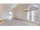 Dining area with high ceiling and large window at 7031 Walton Heath Ln, Charlotte, NC 28277