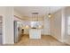 Bright kitchen with white cabinets and tile backsplash at 7031 Walton Heath Ln, Charlotte, NC 28277