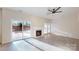 Spacious living room with fireplace and backyard access at 7031 Walton Heath Ln, Charlotte, NC 28277