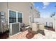 Inviting backyard patio featuring a table with four chairs, perfect for outdoor dining and entertaining at 7122 Abbotts Glen Dr, Charlotte, NC 28212