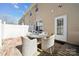 Backyard patio showcasing a table with four chairs, ideal for enjoying outdoor gatherings at 7122 Abbotts Glen Dr, Charlotte, NC 28212