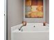 Elegant bathroom featuring a soaking tub with modern fixtures at 7122 Abbotts Glen Dr, Charlotte, NC 28212