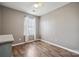 Bright bedroom with wood floors, neutral walls, and a window with natural light at 7122 Abbotts Glen Dr, Charlotte, NC 28212