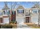 Charming townhouse featuring a one-car garage and well-maintained landscaping at 7122 Abbotts Glen Dr, Charlotte, NC 28212