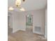 View of a bright dining room with hardwood floors and arched entryways at 1000 Bond Ave, Gastonia, NC 28052