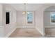 Bright dining room features hardwood floors and an arched doorway at 1000 Bond Ave, Gastonia, NC 28052