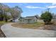 Newly renovated home with a light green exterior and a long driveway at 1000 Bond Ave, Gastonia, NC 28052