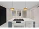 Modern kitchen island with white quartz countertops and a built-in cooktop at 1000 Bond Ave, Gastonia, NC 28052