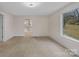 Spacious living room with hardwood floors and large window at 1000 Bond Ave, Gastonia, NC 28052