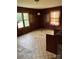 Bedroom with wood walls and damaged flooring at 111 James Love School Rd, Shelby, NC 28152