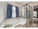 Spa-like bathroom with soaking tub and walk-in shower at 1345 Shimmer Light Cir, Rock Hill, SC 29732