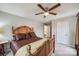 Spacious bedroom with a wooden bed frame and ceiling fan at 1345 Shimmer Light Cir, Rock Hill, SC 29732