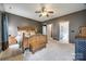 Spacious bedroom with wooden bed frame and ceiling fan at 1345 Shimmer Light Cir, Rock Hill, SC 29732