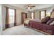 Bedroom with neutral carpet and paint, large windows and a ceiling fan at 1345 Shimmer Light Cir, Rock Hill, SC 29732