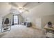 Cozy bedroom with two chairs, ceiling fan, and window at 1345 Shimmer Light Cir, Rock Hill, SC 29732