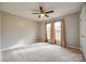 Bright bedroom featuring carpet, neutral walls, and natural light from windows with curtains at 1345 Shimmer Light Cir, Rock Hill, SC 29732