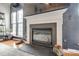 Modern gas fireplace with white mantel and dark stone hearth at 1345 Shimmer Light Cir, Rock Hill, SC 29732