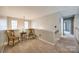 Second floor hallway offers neutral paint and carpet, a reading nook and plenty of natural light at 1345 Shimmer Light Cir, Rock Hill, SC 29732