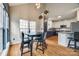 Eat-in kitchen with white and navy cabinets and wood floors at 1345 Shimmer Light Cir, Rock Hill, SC 29732