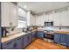 Bright kitchen features butcher block countertops, white cabinets and stainless steel appliances at 1345 Shimmer Light Cir, Rock Hill, SC 29732