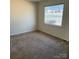 A bedroom with a large window that offers plenty of natural light at 1406 Milan Rd, Charlotte, NC 28216