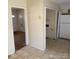 A kitchen area with tile flooring and views into other rooms at 1406 Milan Rd, Charlotte, NC 28216