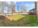 Spacious backyard with deck, fire pit, and plenty of grass at 1490 Kensington Park Ct, Hickory, NC 28602