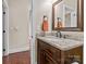 Elegant bathroom with granite vanity, frame mirror, and dark wood cabinets at 1490 Kensington Park Ct, Hickory, NC 28602