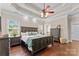 Spacious main bedroom with large bed, hardwood floors, and plenty of natural light at 1490 Kensington Park Ct, Hickory, NC 28602