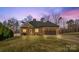 Brick home with a two-car garage and landscaped lawn at 1490 Kensington Park Ct, Hickory, NC 28602