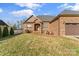 House exterior showcasing a brick facade and landscaping at 1490 Kensington Park Ct, Hickory, NC 28602