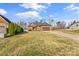 Brick home with two-car garage and landscaping at 1490 Kensington Park Ct, Hickory, NC 28602