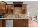 Modern kitchen with dark wood cabinets, granite countertops, and stainless steel appliances at 1490 Kensington Park Ct, Hickory, NC 28602