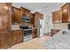 Modern kitchen with wood cabinets and granite countertops at 1490 Kensington Park Ct, Hickory, NC 28602