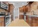 Modern kitchen with dark wood cabinets and granite countertops at 1490 Kensington Park Ct, Hickory, NC 28602