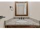 Powder room with granite vanity top and framed mirror at 1490 Kensington Park Ct, Hickory, NC 28602