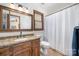 Clean bathroom with granite countertop and shower/tub combo at 1601 Bennington Nw Dr, Concord, NC 28027