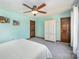 Bedroom with white armoire and ceiling fan at 1601 Bennington Nw Dr, Concord, NC 28027