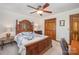 Bedroom with wood furniture and ceiling fan at 1601 Bennington Nw Dr, Concord, NC 28027