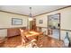 Bright dining room with hardwood floors and view into living room at 1601 Bennington Nw Dr, Concord, NC 28027