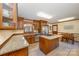 Spacious kitchen with island, granite countertops, and wood cabinets at 1601 Bennington Nw Dr, Concord, NC 28027