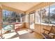 Cozy screened porch with seating and access to backyard at 1601 Bennington Nw Dr, Concord, NC 28027