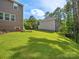 Backyard view of two homes and fence at 17718 Snug Harbor Rd, Charlotte, NC 28278