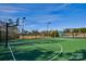 Community basketball court with two hoops and pool in background at 17718 Snug Harbor Rd, Charlotte, NC 28278