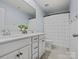 Bathroom with double vanity, white cabinets, and ruffled shower curtain at 17718 Snug Harbor Rd, Charlotte, NC 28278