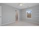 Bedroom with window, closet, and floating shelves at 17718 Snug Harbor Rd, Charlotte, NC 28278