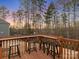 Deck with wooden bar and scenic wooded view at 17718 Snug Harbor Rd, Charlotte, NC 28278